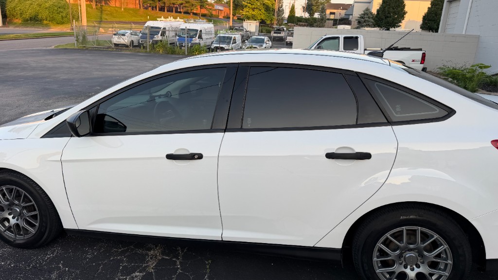 White Ford Focus sedan side profile showing 35% front and 5% rear window tint